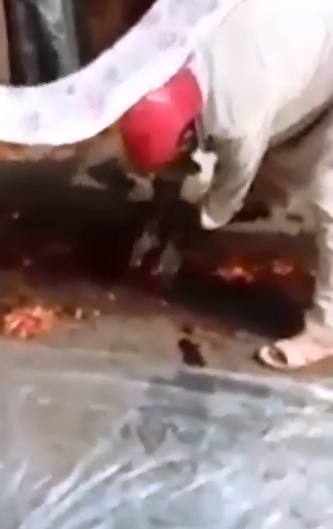 Man Carefully Removes One Piece at a Time and Places it on the Plastic 