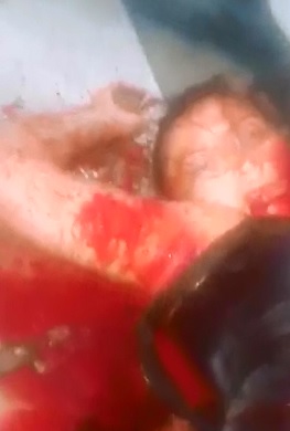 Young Couple both with their Throats Slit Lie Dead on the Bus Floor 