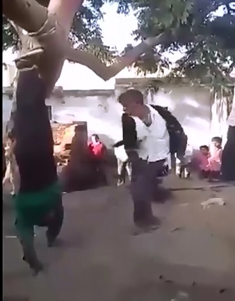 Man who slept with a married woman is tied upside down and flogged 100 times for adultery 