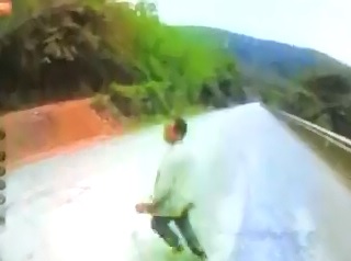 Man Crossing Road is Run Over and Buried by a Bus