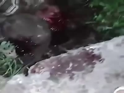 Man is stoned to death and has a stick shoved in his mouth