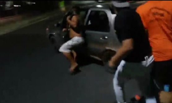 Thief Being Beaten Manages to Flee Holding onto Car Door