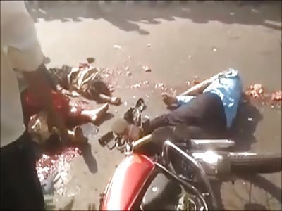 Woman crying over dead husband and son both with head crushed by truck