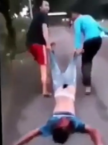 Dragged Down the Street Then Killed with Stone and Ran Over with Motorcycle