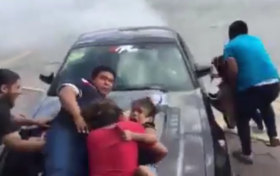 Guy Holding his Daughter Gets hit in Car Show