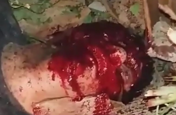 Close up on a thief drowning in his blood