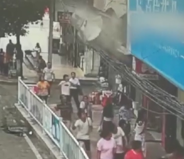 Sign Collapses On Busy Sidewalk Crushing Several Pedestrians 