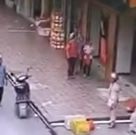 Building Sign Collapses on Couple Walking