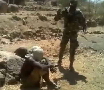 Machine Gun Execution of Guy with Bag over His Head in Cameroon