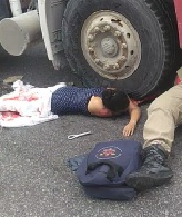 Lady Alive Under a Wheel