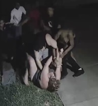 Police searching for gang  who attacked couple in their own driveway