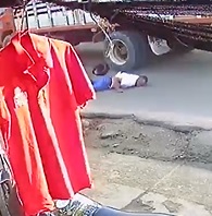 Biker Collides with Truck