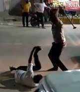 Two Dudes Beat the Shit out of Guy with Weapons