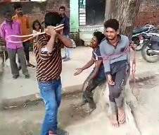 Dudes Tied to Tree and Tortured with Bamboo Kane