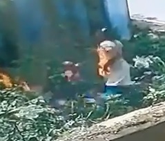 Woman Sets Herself on Fire with Her Kid in Her Hands...Bitch