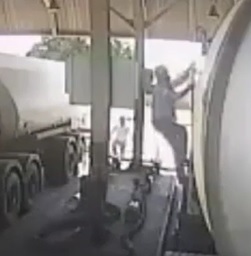 Guy falls from semi trailer.