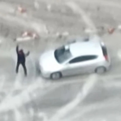 Drone Footage Appears to Show Russian Soldiers Shooting Civilians with His Hands Up.