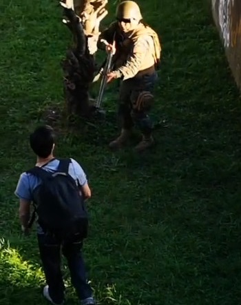 Chilean Military Officer Shooting a Protester