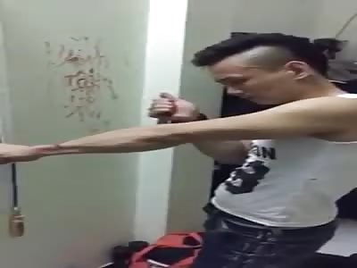 Idiot is given cuts in the arm to declare his love for his ex-girlfriend