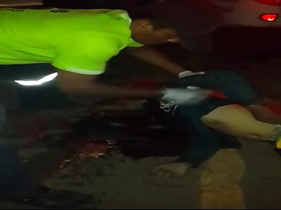 Pedestrian run over with the brain scattered on the pavement