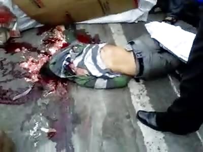 Lifting a corpse biker crushed by a truck