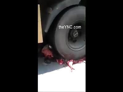 Motorcyclist completely crushed by a truck