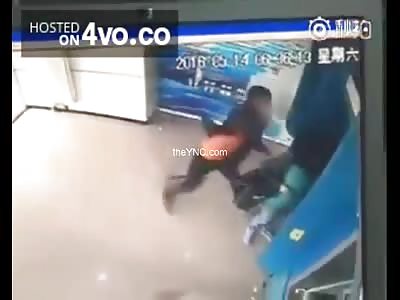 Mugger strikes a woman with a brick on his head