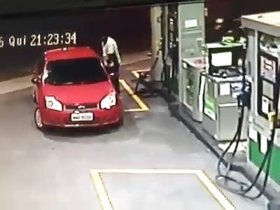 CAR RUNS OVER GAS STATION ATTENDANT