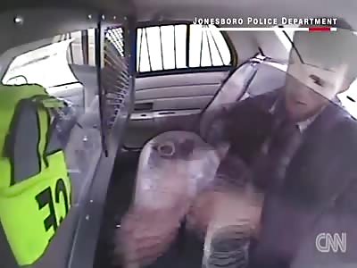 SUSPECT BEING EJECTED FROM POLICE CRUISER