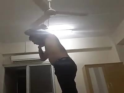 MAN HANGS HIMSELF IN THE FAN 