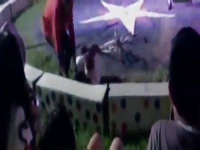 CIRCUS ACROBAT CYCLING BACKWARDS ON TIGHT ROPE FALLS