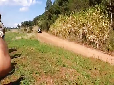 ROCK HITS MAN'S FACE WHEN RACE CAR FLIES AROUND COURSE