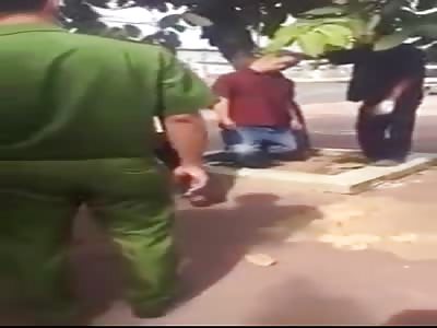 HANGED MAN IN A TREE ON THE SIDEWALK