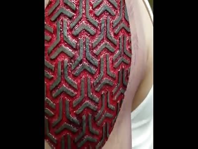 SCARIFICATION