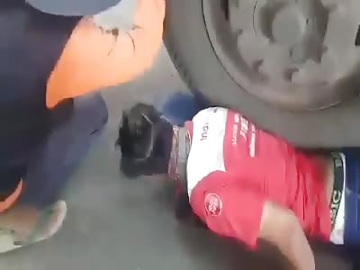 ARM STUCK UNDER THE TRUCK TIRE
