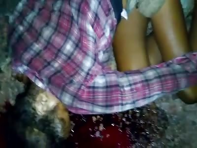 DEAD WOMAN LYING ON THE DIRTY GROUND