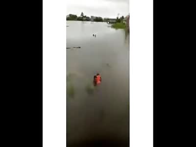 FIVE-YEAR-OLD BOY DEAD FROM DROWNING IS TAKEN OUT OF THE WATER