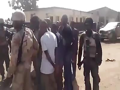 SOLDIER SHOWS DECAPITATED HEAD AS A TROPHY