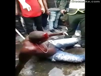 MAN BEATEN BY MOB IS SAVED BY POLICE