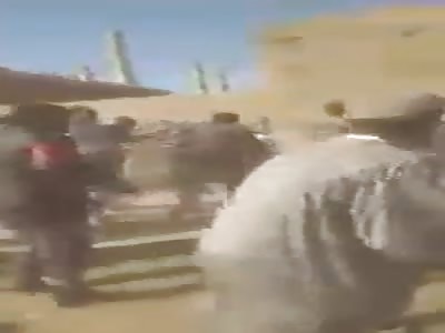 PUNISHMENT: MAN BEING WHIPPED BY MOB