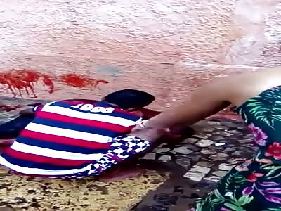 MAN DYING, COVERED WITH BLOOD