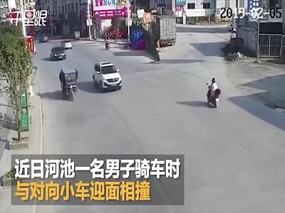 RIDER HIT CAR AND TURNED 360 DEGREES TO LAND IN ASPHALT