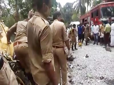 BODY BEING REMOVED FROM THE WRECKAGE OF A TRUCK