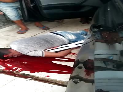 MAN LIES IN A POOL OF BLOOD