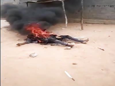 MAN BURNING AND THE CROWD LAUGHIN