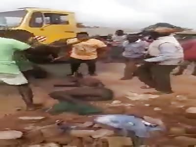 MAN BEING BEATEN AND STONED