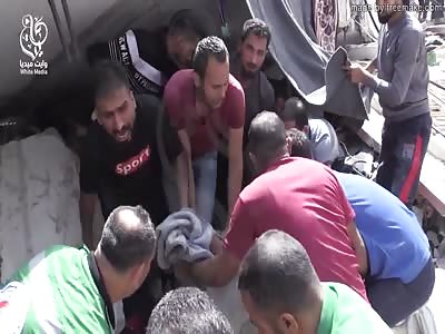 BOMBING VICTIMS TAKING OF DEBRIS