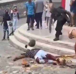 COLOMBIAN POLICEMAN BEING KILLED BY MOB (FULL VIDEO)