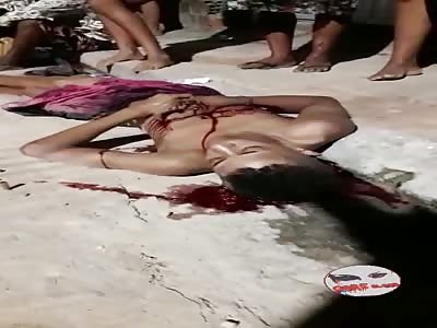 YOUNG MAN DYING IN THE DIRTY STREET OF THE FAVELA