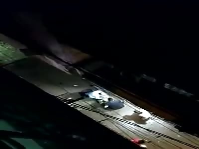 MAN BEING STONED TO DEATH IN THE ALLEY